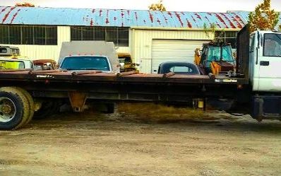 Photo of a 1999 GMC C8500 Roll-Off Truss Delivery Truck for sale